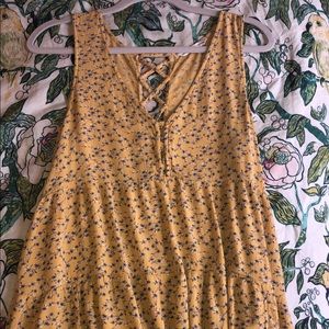 Yellow top with blue floral pattern
